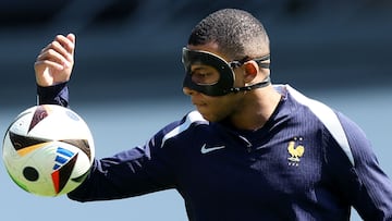 France's forward #10 Kylian Mbappe, wearing a protective mask, takes part in a MD-1 training session at the Home Deluxe Arena Stadium in Paderborn, western Germany, on June 24, 2024, on the eve of their UEFA Euro 2024 Group D football match against Poland. (Photo by FRANCK FIFE / AFP)