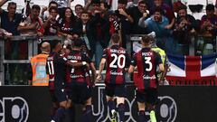 Bologna Scottish midfielder Lewis Ferguson (hidden) celebrates with fans and teammates after scoring during the Italian Serie A football match Juventus vs Bologna on August 27, 2023 at the �Allianz Stadium� in Turin. (Photo by MARCO BERTORELLO / AFP)