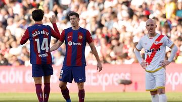 Barcelona's Portuguese forward #14 Joao Felix and Barcelona's Polish forward #09 Robert Lewandowski celebrate after Rayo Vallecano's French defender #24 Florian Lejeune scored an own goal during the Spanish league football match between Rayo Vallecano de Madrid and FC Barcelona on November 25, 2023. (Photo by OSCAR DEL POZO / AFP)