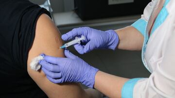 DOMODEDOVO, RUSSIA - DECEMBER 14: (RUSSIA OUT)  A medical worker administers a shot of Russia&#039;s Sputnic V coronavirus vaccine at the policlinic on December 14, 2020 in Domovedovo, 37 km (23 miles) south of  Moscow, Russia. Russia&#039;s daily tally o