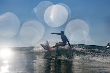 Team USA's Carissa Moore rides a wave during a free training session at the Tsurigasaki Surfing Beach, Chiba.