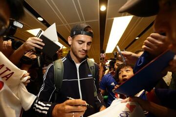 Alvaro Morata of Chelsea FC signs autograph for fans after he arrives at Changi International Airport ahead of the International Champions Cup.