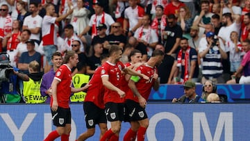 Austria's players celebrate scoring their third goal during the UEFA Euro 2024 Group D football match between Poland and Austria at the Olympiastadion in Berlin on June 21, 2024. (Photo by AXEL HEIMKEN / AFP)