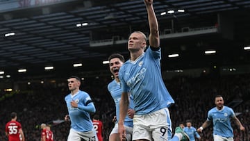 Manchester City's Norwegian striker #09 Erling Haaland celebrates after scoring the opening goal from the penalty spot during the English Premier League football match between Manchester United and Manchester City at Old Trafford in Manchester, north west England, on October 29, 2023. (Photo by Paul ELLIS / AFP) / RESTRICTED TO EDITORIAL USE. No use with unauthorized audio, video, data, fixture lists, club/league logos or 'live' services. Online in-match use limited to 120 images. An additional 40 images may be used in extra time. No video emulation. Social media in-match use limited to 120 images. An additional 40 images may be used in extra time. No use in betting publications, games or single club/league/player publications. / 