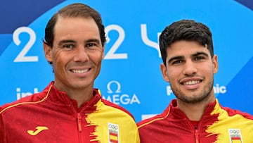 Spain's Rafael Nadal (L) and Spain's Carlos Alcaraz pose for pictures during a press conference at the Olympic Village, in Paris, on July 24, 2024, prior to take part in the men's singles tennis competition of the Paris 2024 Olympic Games. (Photo by MARTIN BERNETTI / AFP)