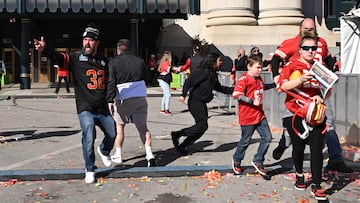 People flee after shots were fired at Union Station near the Kansas City Chiefs' Super Bowl LVIII victory parade on February 14, 2024, in Kansas City, Missouri. Multiple people were injured after gunfire erupted at the Kansas City Chiefs Super Bowl victory rally on Wednesday, local police said. (Photo by ANDREW CABALLERO-REYNOLDS / AFP)