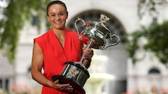 (FILE) In this file photo taken on January 30, 2022 Australia's Ashleigh Barty poses with the 2022 Australian Open winner's trophy in Melbourne on January 30, 2022, following her victory over Danielle Collins of the US in the women's singles final of the 