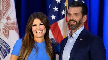 (FILES) In this file photo taken on February 3, 2020 Donald Trump Jr. (R) and his girlfriend Kimberly Guilfoyle smile during a "Keep Iowa Great" press conference in Des Moines, IA. - Donald Trump Jr's his girlfriend Kimberly Guilfoyle tested positive for the coronavirus on July 3, 2020, US media reported. (Photo by JIM WATSON / AFP)