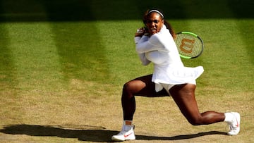 LONDON, ENGLAND - JULY 10: Serena Williams of the United States plays a backhand against Camila Giorgi of Italy during their Ladies' Singles Quarter-Finals match on day eight of the Wimbledon Lawn Tennis Championships at All England Lawn Tennis and