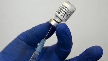 A nurse fills a syringe with the Pfizer-BioNTech's Comirnaty COVID-19 vaccine against the novel coronavirus at a doctor's practice in Suhl, Germany, on May 6, 2021. (Photo by Christof STACHE / AFP)