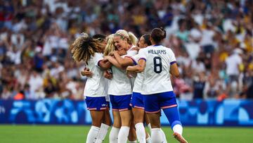 US' midfielder #03 Korbin Albert celebrates with teammates after scoring her team's second goal during the women's group B football match between Australia and the USA of the Paris 2024 Olympic Games at the Marseille Stadium in Marseille on July 31, 2024. (Photo by Pascal GUYOT / AFP)