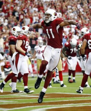 El otro protagonista de la portada del Maden 10, Larry Fitzgerald, esquiv車 la maldici車n. Jug車 como titular todos los partidos de los Cards en 2009, consiguiendo su record personal con 13 touchdowns en esa temporada.