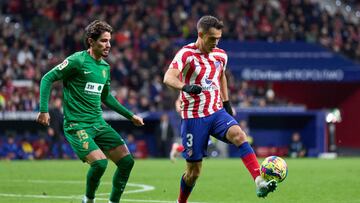 MADRID, SPAIN - DECEMBER 29: Sergio Reguilon of Atletico de Madrid is challenged by Alex Collado of Elche CF during the LaLiga Santander match between Atletico de Madrid and Elche CF at Civitas Metropolitano Stadium on December 29, 2022 in Madrid, Spain. (Photo by Angel Martinez/Getty Images)