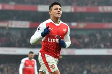 Arsenal's Chilean striker Alexis Sanchez celebrates after scoring their second goal from the penalty spot during the English Premier League football match between Arsenal and Hull City at the Emirates Stadium in London on February 11, 2017.
Arsenal won the game 2-0. / AFP PHOTO / Glyn KIRK / RESTRICTED TO EDITORIAL USE. No use with unauthorized audio, video, data, fixture lists, club/league logos or 'live' services. Online in-match use limited to 75 images, no video emulation. No use in betting, games or single club/league/player publications. /
