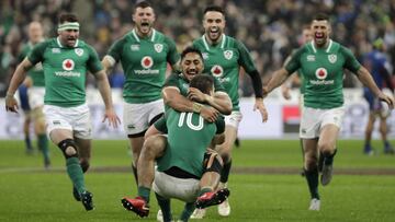 Ireland's fly-half Jonathan Sexton (R) celebrates with Ireland's centre Bundee Aki after scoring a drop goal to win the Six Nations rugby union match between France and Ireland at the Stade de France in Paris on February 3, 2018.