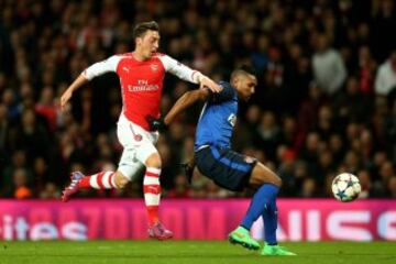 LONDON, ENGLAND - FEBRUARY 25:  Mesut Oezil of Arsenal and Wallace of Monaco compete for the ball during the UEFA Champions League round of 16, first leg match between Arsenal and Monaco at The Emirates Stadium on February 25, 2015 in London, United Kingdom.  (Photo by Clive Mason/Getty Images)