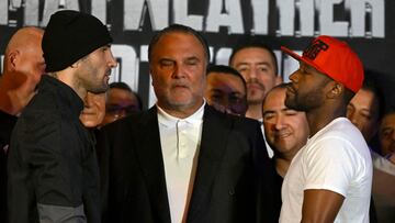 US boxers Floyd Mayweather Jr. (R) and John Gutti III (L) look at each other during the weighing ceremony for his upcoming exhibition in Mexico City on August 23, 2024. Mayweather Jr. and Gotti III will face each other in an exhibition fight in Mexico on August 24, 2024. (Photo by ALFREDO ESTRELLA / AFP)