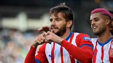 Girona's Spanish forward #24 Cristian Portugues celebrates after scoring his team's first goal during the Spanish league football match between RC Celta de Vigo and Girona FC at the Balaidos stadium in Vigo on January 28, 2024. (Photo by MIGUEL RIOPA / AFP)