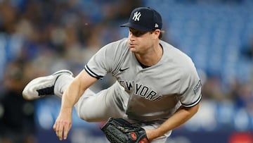 (FILES) Gerrit Cole #45 of the New York Yankees pitches in the ninth inning of their MLB game against the Toronto Blue Jays at Rogers Centre on September 27, 2023 in Toronto, Canada.   Cole Burston/Getty Images/AFP. Gerrit Cole, last year's unanimous American League Cy Young Award winner as best pitcher, will be out at least a month with a right elbow injury, multiple reports said March 13, 2024. (Photo by Cole BURSTON / GETTY IMAGES NORTH AMERICA / AFP)