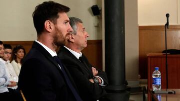 Messi y su padre en el banquillo.