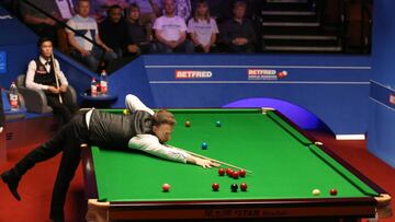 Judd Trump plays a shot as opponent Thepchaiya Un-Nooh looks on during day five of the 2019 Betfred World Championship at The Crucible, Sheffield. (Photo by Nigel French/PA Images via Getty Images)
