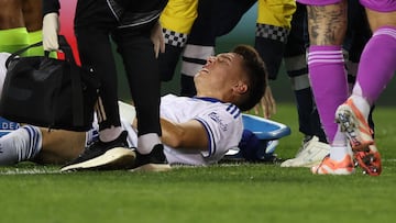 FC Copenhagen's Mexican defender #13 Rodrigo Huescas reacts after being injured during the UEFA Champions League first round day 2 football match between Qarabag FC and FC Copenhagen at the Tofiq Bahramov Republican Stadium in Baku on October 1, 2025. (Photo by Giorgi ARJEVANIDZE / AFP)