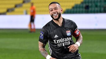 (FILES) In this file photo taken on April 18, 2021 Lyon&#039;s Dutch forward Memphis Depay celebrates after scoring a penalty kick during  the French L1 football match between FC Nantes and Olympique Lyonnais at the La Beaujoire Stadium in Nantes, western