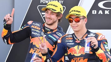Winner Red Bull KTM Ajo's Australian rider Remy Gardner (L) celebrate with second placed Red bull Ktm Ajo's Spanish rider Raul Fernandez after the Moto2 race of the Italian Moto GP Grand Prix at the Mugello race track in Scarperia e San Piero on May 30, 2021. (Photo by Tiziana FABI / AFP)