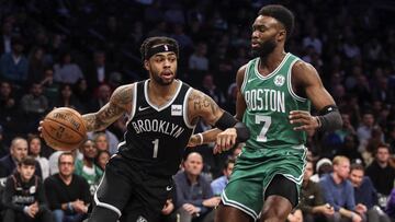 D’Angelo Russell avanza ante Jaylen Brown.