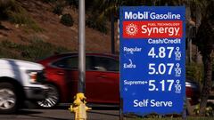 Gas prices grow along with inflation as this sign at a gas station shows in Solana Beach, California.