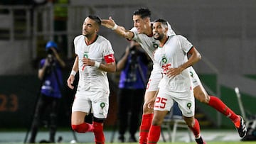 Morocco's midfielder #7 Hakim Ziyech (L) celebrates with Morocco's defender #5 Nayef Aguerd (C) and Morocco's defender #25 Yahya Attiat Allah (R) after scoring his team's first goal during the Africa Cup of Nations (CAN) 2024 group F football match between Zambia and Morocco at the Stade Laurent Pokou in San Pedro on January 24, 2024. (Photo by SIA KAMBOU / AFP)