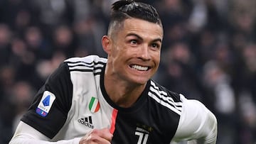 Juventus' Portuguese forward Cristiano Ronaldo celebrates after scoring his third goal during the Italian Serie A football match Juventus vs Cagliari on January 6, 2020 at the Juventus Allianz stadium in Turin. (Photo by Marco Bertorello / AFP)