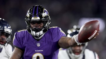 BALTIMORE, MARYLAND - JANUARY 20: Lamar Jackson #8 of the Baltimore Ravens scores an 8 yard touchdown against the Houston Texans during the fourth quarter in the AFC Divisional Playoff game at M&T Bank Stadium on January 20, 2024 in Baltimore, Maryland. Rob Carr/Getty Images/AFP (Photo by Rob Carr / GETTY IMAGES NORTH AMERICA / Getty Images via AFP)