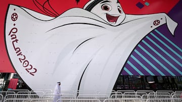 15 November 2022, Qatar, Doha: A man walks past La'eeb, the official World Cup mascot, to the Main Ticketing Center. The World Cup 2022 kicks off on November 20, 2022 with the opening match between Qatar and Ecuador. Photo: Federico Gambarini/dpa (Photo by Federico Gambarini/picture alliance via Getty Images)