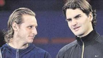 <b>HERMANOS EN ARMAS Y AGENCIA. </b>David Nalbandián y Roger Federer: confidencias en Shanghai.