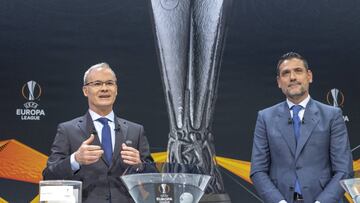 UEFA deputy secretary general Giorgio Marchetti, left, and former Spanish football player Andres Palop, right, ambassador for the UEFA Europa League, speak during the drawing of the games for the Europa League 2018/19 Round of 16, at the UEFA headquarters