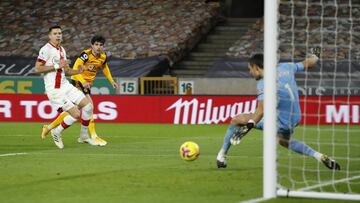 WOLVERHAMPTON, ENGLAND - NOVEMBER 23: Alex McCarthy of Southampton saves from Pedro Neto of Wolverhampton Wanderers as he is challenged by Jan Bednarek of Southampton during the Premier League match between Wolverhampton Wanderers and Southampton at Molin