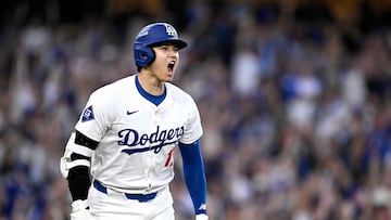 (FILES) Shohei Ohtani #17 of the Los Angeles Dodgers celebrates a three run home run during the second inning against the San Diego Padres in Game One of the Division Series at Dodger Stadium on October 5, 2024 in Los Angeles, California. Shohei Ohtani was named Major League Baseball's National League Most Valuable Player on November 21, 2024 after a historic 2024 season that ended with his first World Series title. The 30-year-old Japanese designated hitter for the Los Angeles Dodgers took his second MVP award in a row and third in four years after winning the American League MVP in 2021 and 2023 with the Los Angeles Angels. (Photo by Orlando Ramirez / GETTY IMAGES NORTH AMERICA / AFP)