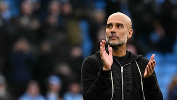 Manchester City's Spanish manager Pep Guardiola celebrates with the fans at the end of the English Premier League football match between Manchester City and Manchester United at the Etihad Stadium in Manchester, north west England, on September 14, 2025. (Photo by Oli SCARFF / AFP) / RESTRICTED TO EDITORIAL USE. No use with unauthorized audio, video, data, fixture lists, club/league logos or 'live' services. Online in-match use limited to 120 images. An additional 40 images may be used in extra time. No video emulation. Social media in-match use limited to 120 images. An additional 40 images may be used in extra time. No use in betting publications, games or single club/league/player publications. /