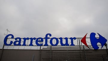 (FILES) this file photo taken on January 13, 2021 shows the logo of a French retail giant Carrefour surpermarket in Saint-Herblain, outside the city of Nantes. - French retail group Carrefour announced on June 5, 2021 it will file a complaint after one of