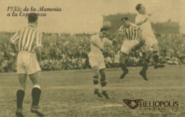 PATRONATO, domingo 21-04-1935, 21ª Jornada: BETIS BALOMPIÉ-2 (UNAMUNO, LECUE, de penalti) vs. Sevilla FC-2 (José LÓPEZ Martínez; Miguel López TORRONTEGUI). El delantero sevillista CAMPANAL I-Guillermo González del Río García-, al que vemos a la izquierda del defensa bético Serafín AEDO Renieblas, salta por un balón de forma infructosa.