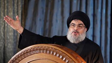 FILE PHOTO: Lebanon's Hezbollah leader Sayyed Hassan Nasrallah gestures as he addresses his supporters in a rare public appearance during a religious ceremony on the eve of Ashura in Beirut's southern suburbs November 13, 2013. REUTERS/Hasan Shaaban (LEBANON - Tags: POLITICS RELIGION)/File Photo