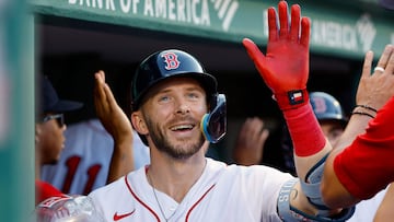 BOSTON, MA - SEPTEMBER 14: Trevor Story #10 of the Boston Red Sox is congratulated in the dugout after his three-run home run against the New York Yankees during the eighth inning of game one of a doubleheader at Fenway Park on September 14, 2023 in Boston, Massachusetts. (Photo By Winslow Townson/Getty Images) (Photo by Winslow Townson / GETTY IMAGES NORTH AMERICA / Getty Images via AFP)