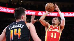 ATLANTA, GEORGIA - FEBRUARY 02: Trae Young #11 of the Atlanta Hawks attempts a shot against Josh Okogie #2 of the Phoenix Suns during the fourth quarter at State Farm Arena on February 02, 2024 in Atlanta, Georgia. NOTE TO USER: User expressly acknowledges and agrees that, by downloading and/or using this photograph, user is consenting to the terms and conditions of the Getty Images License Agreement.   Kevin C. Cox/Getty Images/AFP (Photo by Kevin C. Cox / GETTY IMAGES NORTH AMERICA / Getty Images via AFP)