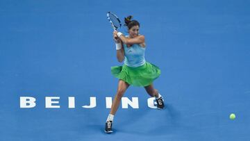 BEIJING, CHINA - OCTOBER 01:  Garbine Muguruza of Spain returns the ball in her match against Irina-Camelia Begu of Romania during the Women&#039;s singles first round on day one of the 2016 China Open at the China National Tennis Centre, on October 1, 2016 in Beijing, China.  (Photo by Etienne Oliveau/Getty Images)