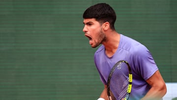 Spain's Carlos Alcaraz reacts after a point as he plays against Italy's Lorenzo Musetti during the Monte Carlo ATP Masters Series Tournament final tennis match at the Monte Carlo Country Club in Roquebrune-Cap-Martin on April 13, 2025. (Photo by Valery HACHE / AFP)