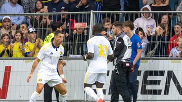 Saudi Pro League football club Al-Nassr's Portuguese forward Cristiano Ronaldo celebrates scoring with his teammate Nassr's Senegalese Forward #10 Sadio Mane during a friendly football match between Al Nassr FC and FC Toulouse in Groedig, Austria on July 30, 2025. (Photo by Johann GRODER / various sources / AFP) / Austria OUT