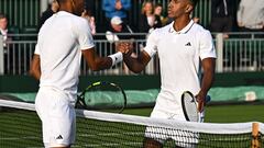 Tennis - Wimbledon - All England Lawn Tennis and Croquet Club, London, Britain - July 3, 2023 Michael Mmoh of the U.S. shakes hands with Canada's Felix Auger Aliassime after winning his first round match REUTERS/Dylan Martinez