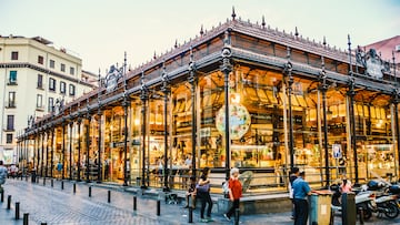 Madrid, Spain - August 6, 2015: Tourists visiting the famous San Miguel Market, Madrid. The market wants to be part of the agenda of Madrid events doing different activities related to leisure and culture, helping to revitalize the old capital.