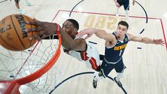 Jun 4, 2023; Denver, CO, USA; Miami Heat center Bam Adebayo (13) dunks against Denver Nuggets forward Michael Porter Jr. (1) during the second half in game two of the 2023 NBA Finals at Ball Arena. Mandatory Credit: Mark J. Terrill/Pool Photo-USA TODAY Sports